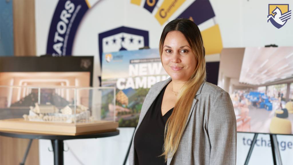 Ms. Malia standing in front of the D-PREP front main entrance.