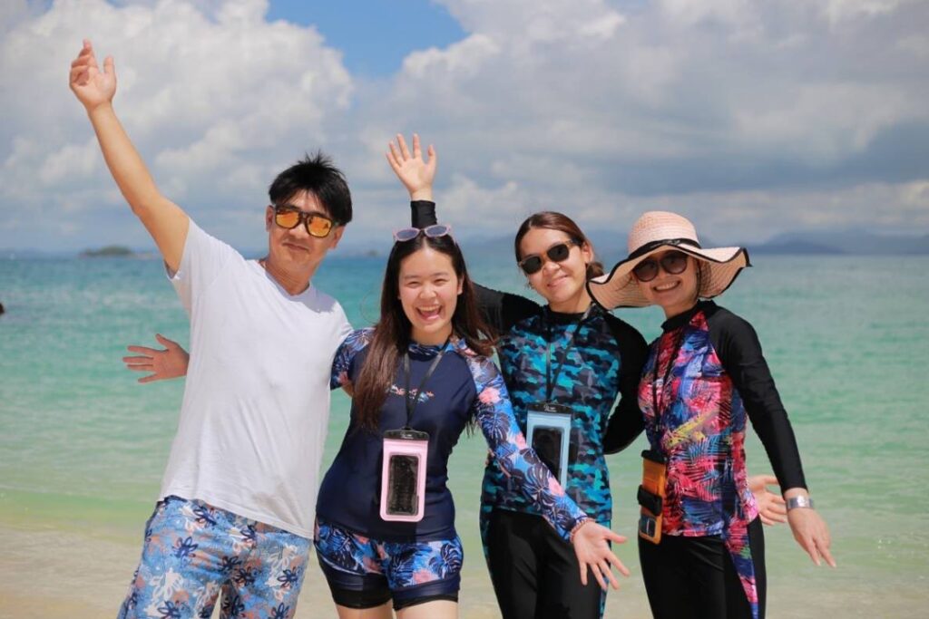 Grade 10 student, Prim, with her family at the beach.