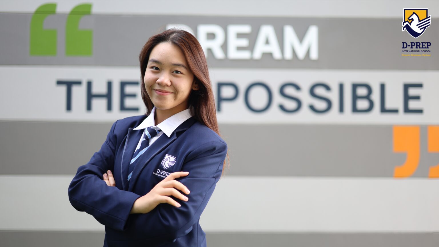 Grade 10 student, Prim, posing in front of the D-PREP sign